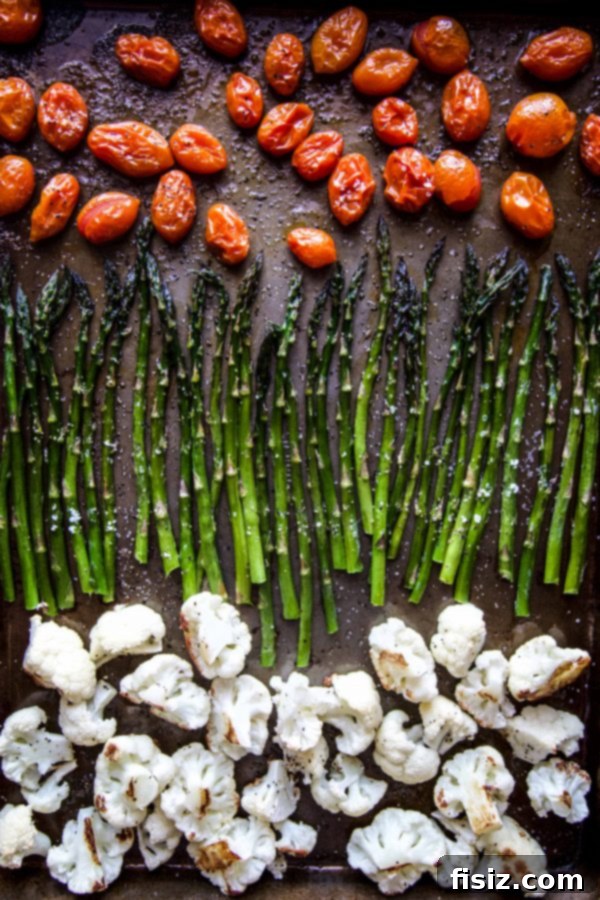 Vibrant Springtime Chickpea Pasta with Garden Vegetables 4 Ingredients for the pasta dish laid out, including fresh vegetables, chickpea pasta, and herbs.