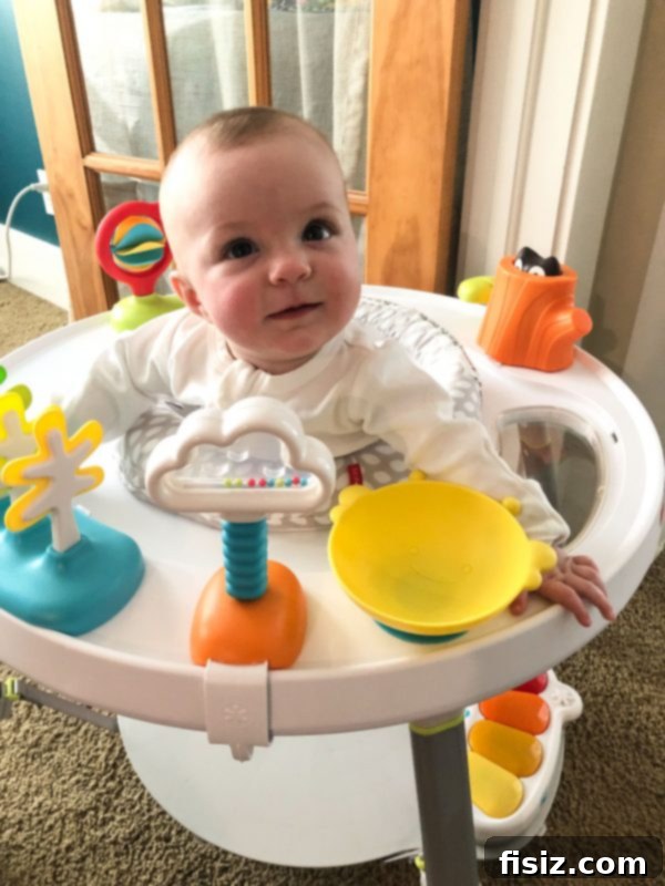 Five Months with Charlie 8 Sweet baby Charlie with a wide, infectious smile in her activity gym