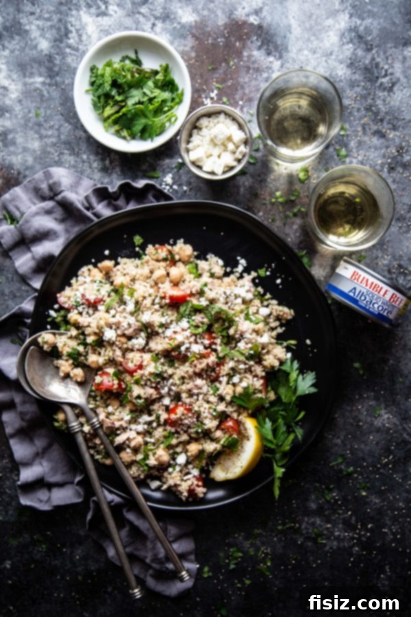 Sun-Drenched Tuna Quinoa Medley 3 Close-up of Mediterranean Tuna and Quinoa Salad ingredients, showcasing fresh vegetables and tuna
