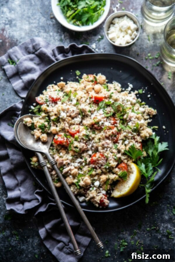 Sun-Drenched Tuna Quinoa Medley 6 Beautifully plated Mediterranean Tuna and Quinoa Salad, garnished with fresh herbs and feta