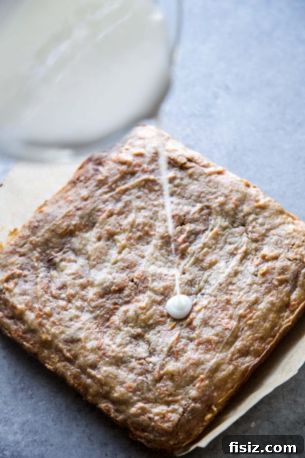 Golden Carrot Cake Blondies 4 Freshly baked Carrot Cake Blondies cooling on a rack