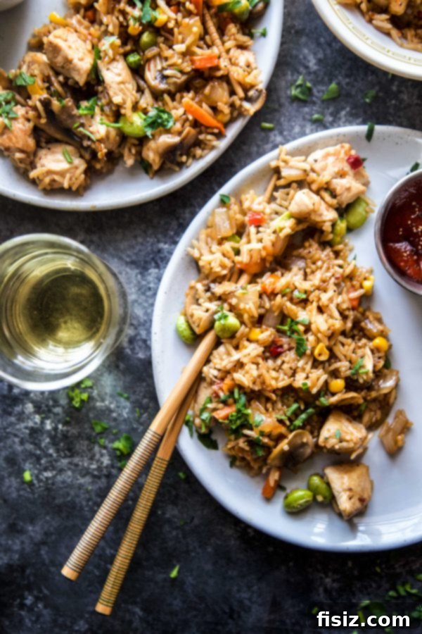 Effortless Homemade Chicken Fried Rice 5 A vibrant and appetizing bowl of Easy Chicken Fried Rice, garnished with fresh green onions and ready to eat.