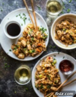 Effortless Homemade Chicken Fried Rice 7 Final dish of Easy Chicken Fried Rice garnished with fresh herbs.