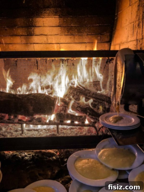Deer Valley: The Ultimate Family Weekend 18 Guests gathered around a stone fireplace, enjoying the interactive Fireside Dining experience