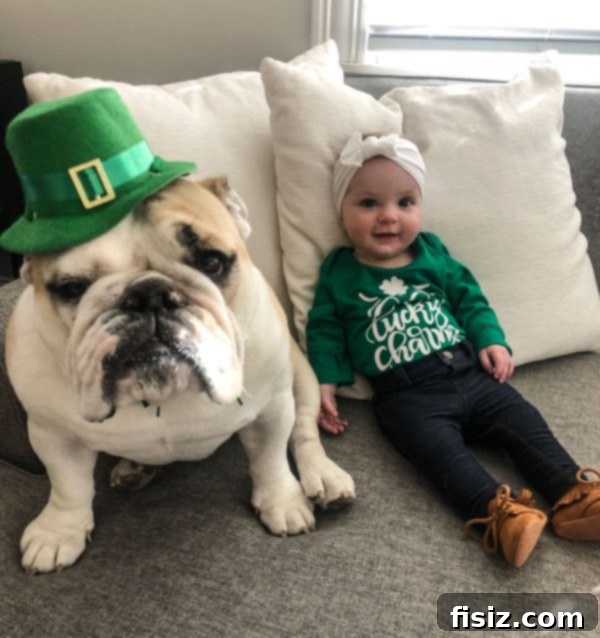 Half a Year with Charlie 7 Charlie and her older sister Juniper, dressed in festive green outfits for St. Patrick's Day, looking adorable together.