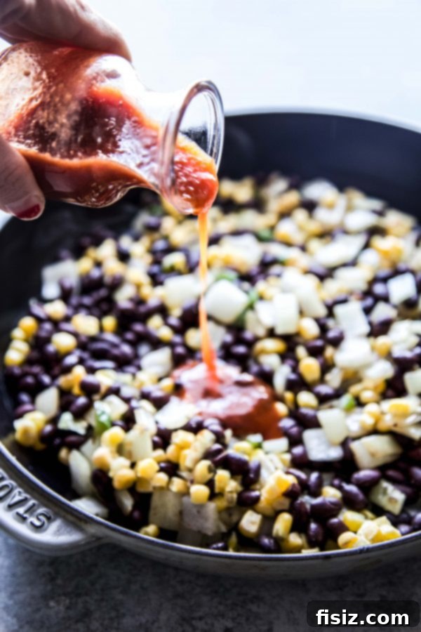 Turkey Meatball Enchilada Skillet 4 Cooked turkey meatballs in a skillet with rich enchilada sauce