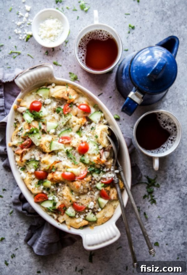 Savory Greek Breakfast Bake 5 Close-up of Greek Croissant Egg Casserole with fresh garnishes