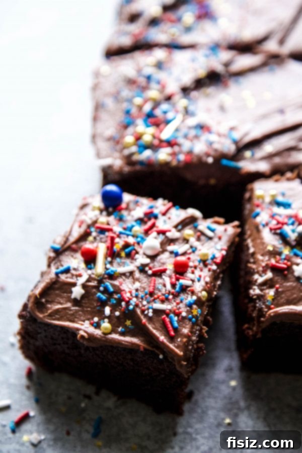 Decadent Double Chocolate Sheet Cake with Cream Cheese Frosting 6 A large chocolate sheet cake generously covered with thick chocolate cream cheese frosting.