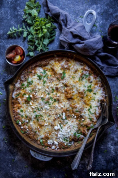 Shawarma Totcho Fiesta 11 Chicken shawarma quinoa skillet bake in a cast iron pan.