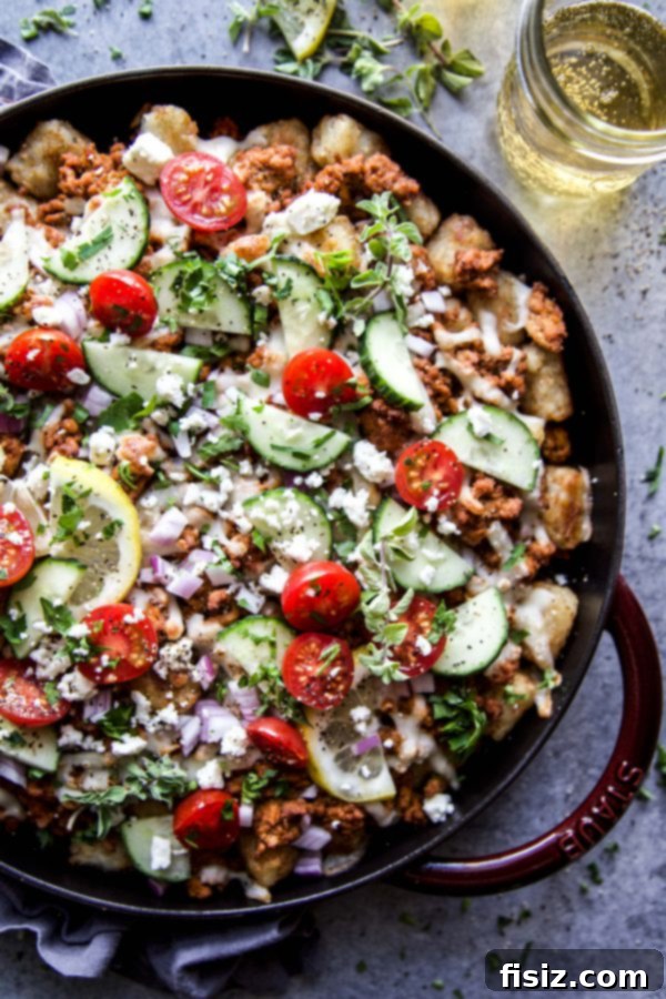 Shawarma Totcho Fiesta 5 A pan of cooked ground chicken seasoned with shawarma spices.