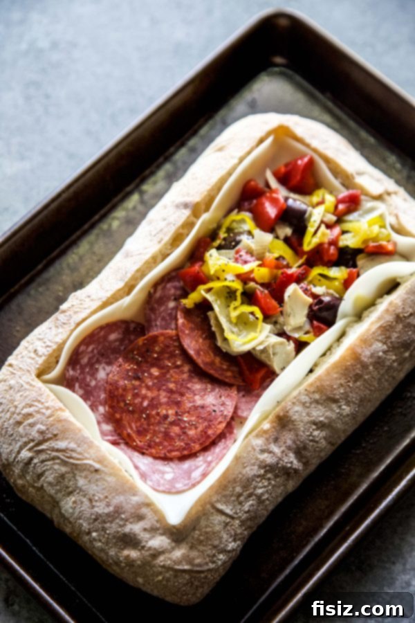 Loaded Antipasto Cheese Bread 4 Freshly prepared Layered Antipasto Cheese Bread ready for baking
