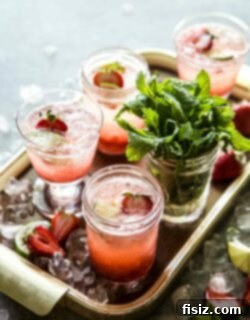 Crimson Gin Tonic 7 A glass of Strawberry Gin and Tonic with fresh berries and mint
