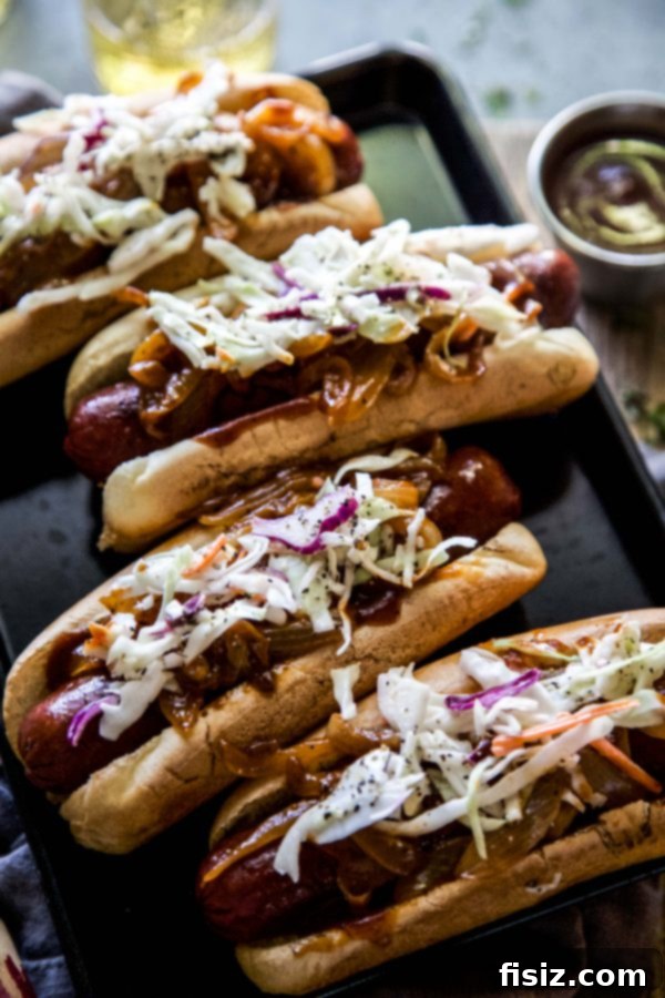 Loaded Barbecue Bison Hot Dogs 6 Close-up of a perfectly grilled bison hot dog with caramelized onions and coleslaw