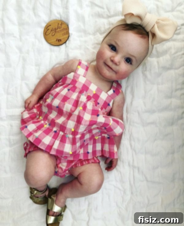 Charlie's Eighth Chapter 2 Smiling 8-month-old baby girl Charlie