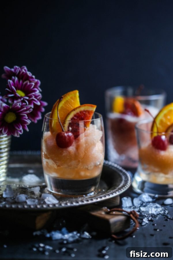 Fresh Mint Rosé Aperol Spritz 13 Chilled Old Fashioned Cocktail Slushie in a glass with an orange peel