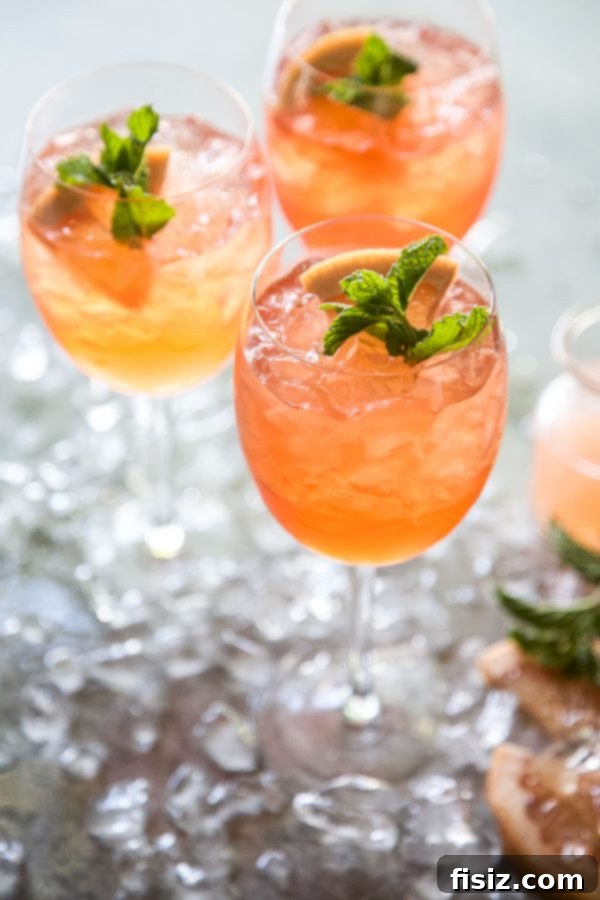 Fresh Mint Rosé Aperol Spritz 3 Close-up of Rosé-Aperol Spritz with fresh mint and grapefruit garnish