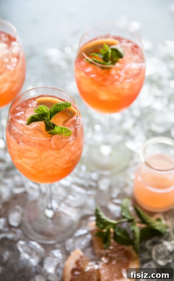 Fresh Mint Rosé Aperol Spritz 6 Serving Rosé-Aperol Spritz in elegant glasses with mint and grapefruit