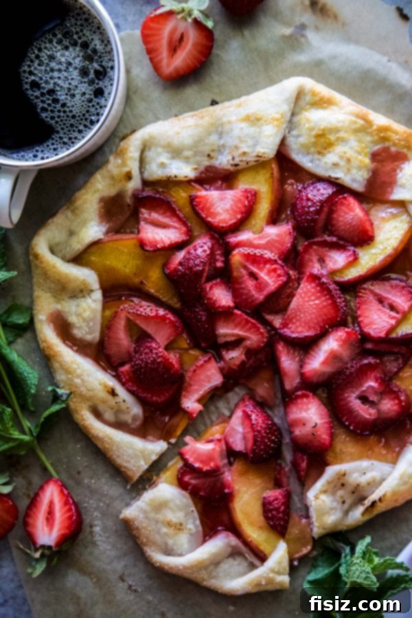 A whole Strawberry-Peach Galette, freshly baked and golden brown