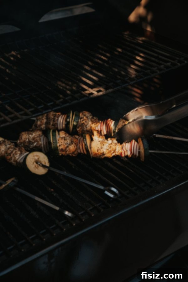Greek Chicken Souvlaki 11 A vibrant platter of freshly grilled Greek Chicken Skewers, garnished and ready for serving.