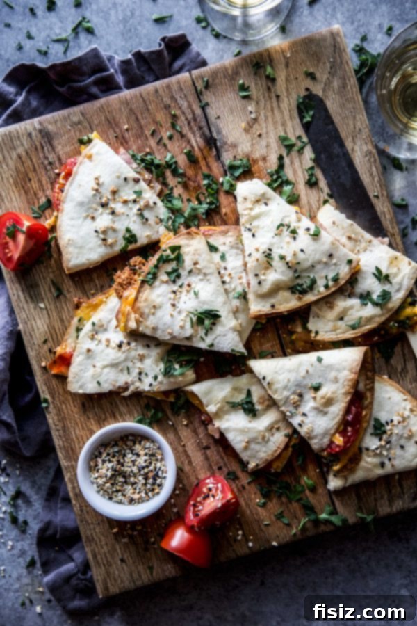 A serving of Everything BLT Baked Quesadillas on a plate, garnished with fresh herbs, ready to be enjoyed.