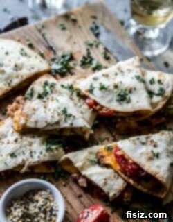 A delicious Everything BLT Baked Quesadilla, cut in half, revealing its savory fillings.