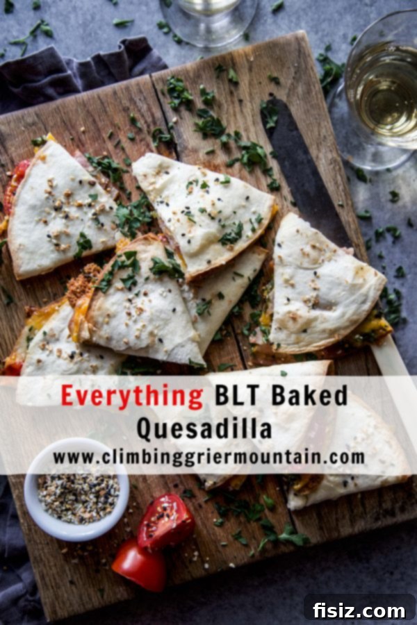 Two freshly baked Everything BLT Baked Quesadillas, cut in half and stacked, showcasing the vibrant ingredients inside.