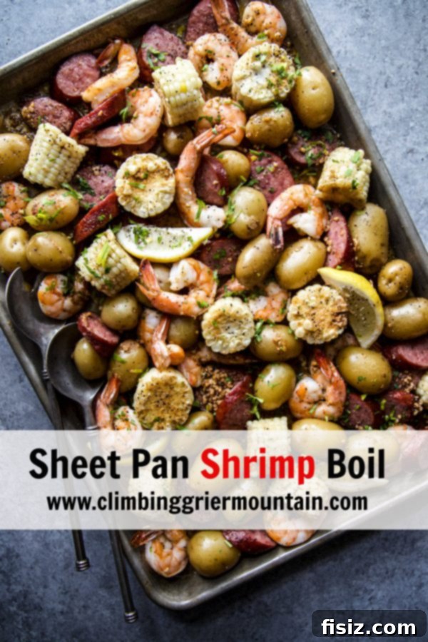 A delicious Sheet Pan Shrimp Boil served directly on the baking sheet, garnished with lemon and herbs