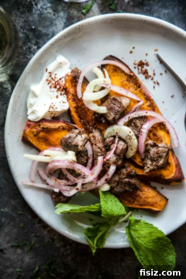 Moroccan Spiced Lamb and Sweet Potato Bowls 2 Exotic Sweet Potato Moroccan Lamb Bowls, a perfect fusion of savory lamb, sweet potatoes, and aromatic Moroccan spices for a comforting meal.