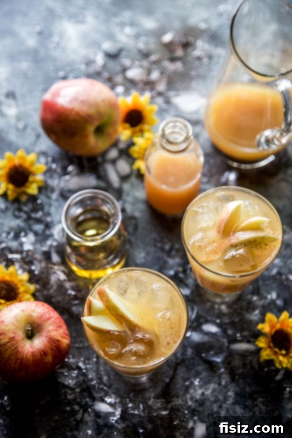 Close-up of a beautifully layered Apple Bourbon Ginger Spritz cocktail, ready to be enjoyed