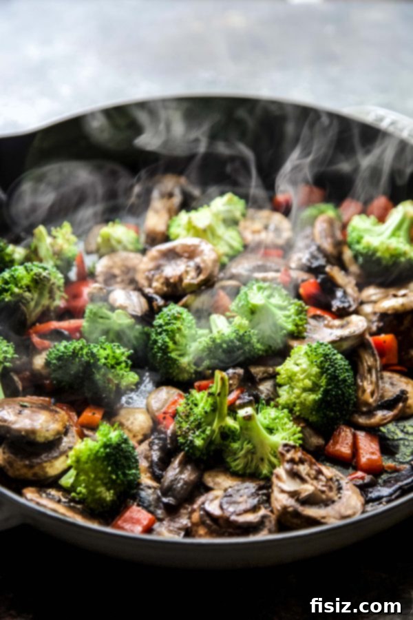 Assortment of fresh ingredients for Pepperoni Pizza Pot Pie, including vegetables, sausage, and cheese