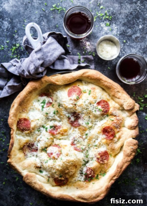 Freshly baked Pepperoni Pizza Pot Pie garnished with vibrant green basil leaves