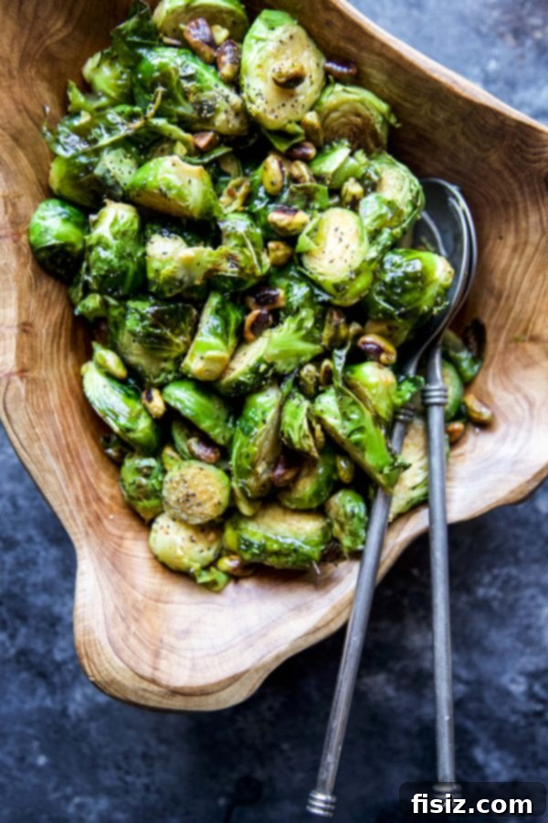 Zesty Brussels Sprouts with Pistachio Crunch 3 Close-up of perfectly roasted Brussels sprouts with glistening glaze