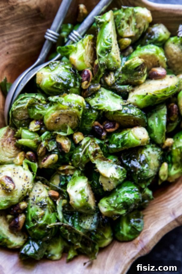 Zesty Brussels Sprouts with Pistachio Crunch 6 A serving of Brussels Sprouts with Pistachios and Lime, garnished with red pepper flakes