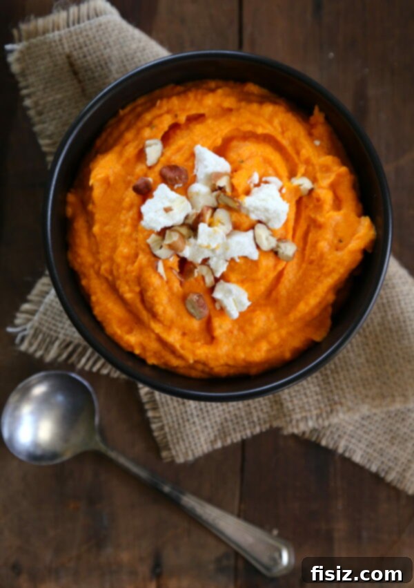 The Definitive Thanksgiving Guide 5 Harissa sweet potatoes with goat cheese and candied pecans, a vibrant and flavorful Thanksgiving side dish