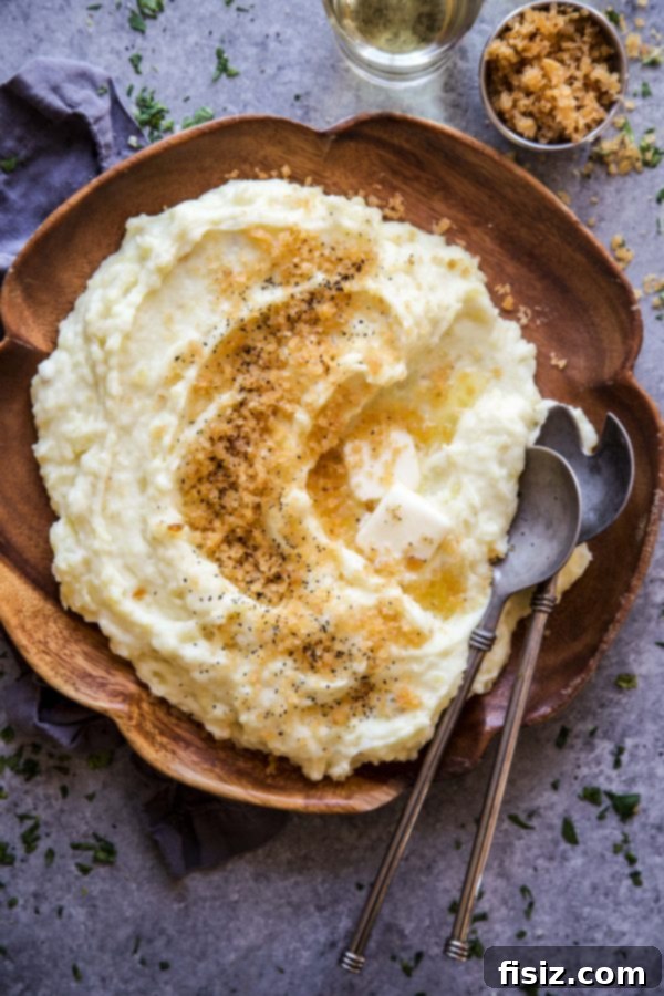 Effortless Mashed Potatoes with a Crispy Chip Crown 3 Close-up of a serving of mashed potatoes topped with the crispy potato chip mixture