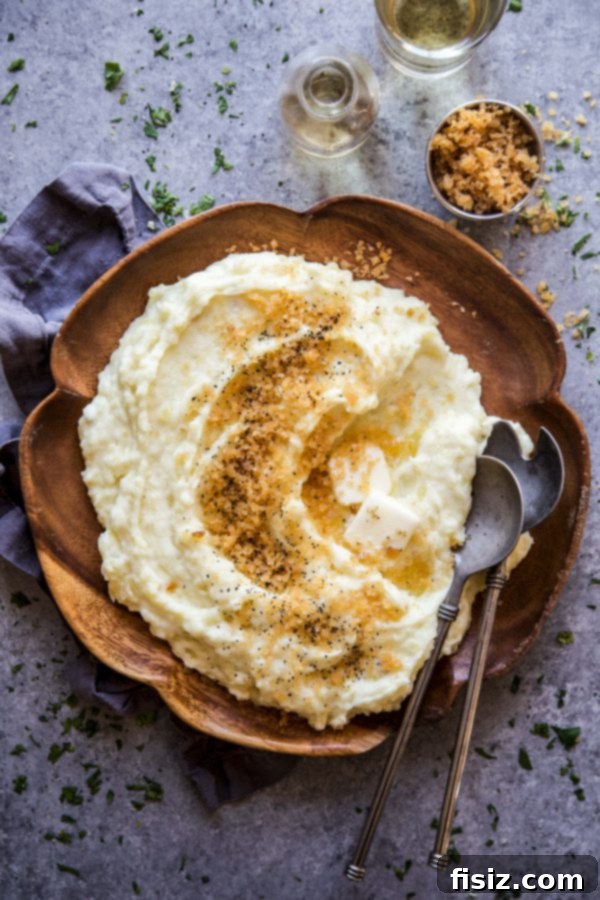 Effortless Mashed Potatoes with a Crispy Chip Crown 6 Mashed potatoes with a generous amount of crunchy topping in a serving bowl