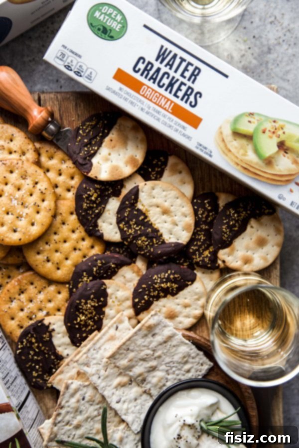Festive Crackers: 3 Easy DIY Ideas 5 Elegant chocolate ganache crackers topped with festive gold sprinkles on parchment paper.
