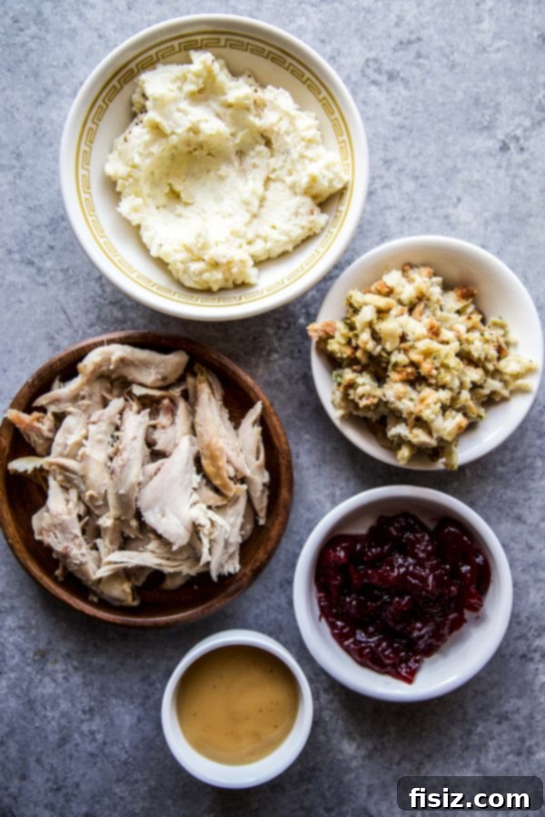 Thanksgiving Leftover Rolls 4 A selection of Thanksgiving Leftovers laid out on a plate for assembly.