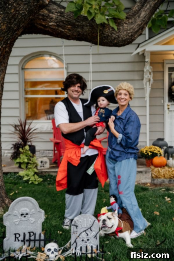 Our First Year with Charlie 19 Family Halloween photo with Charlie dressed as Napoleon, alongside her parents in Bill and Ted costumes.