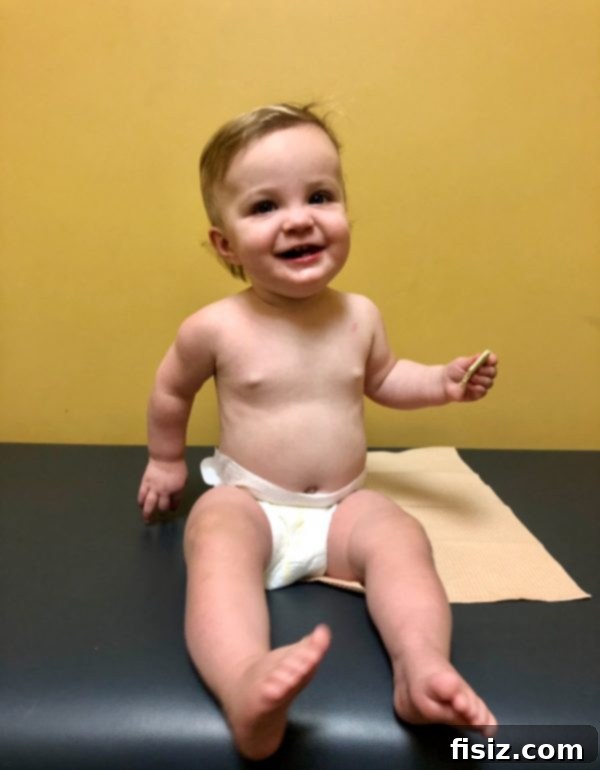 Our First Year with Charlie 8 Charlie smiling with a cute ponytail, a milestone for her and her parents.