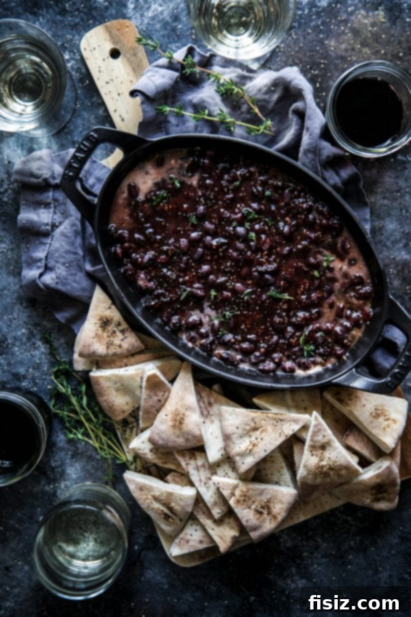 Unwrap Your Best Holiday 4 Raspberry Chipotle Black Bean Gratin, a warm and savory holiday appetizer with a hint of spice.