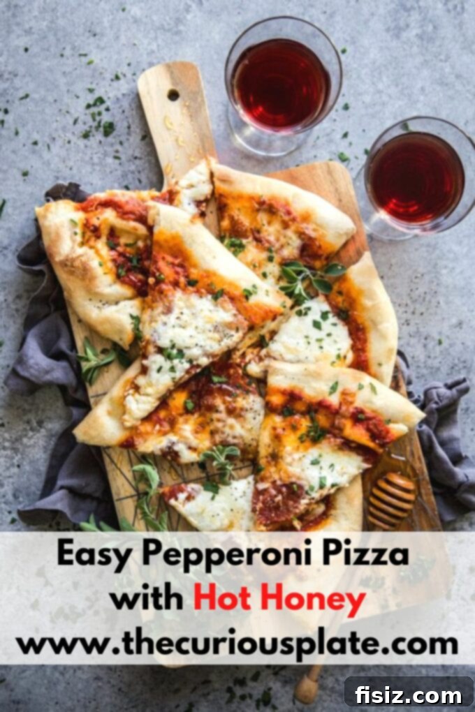 Simple Hot Honey Pepperoni Pizza 11 Easy Pepperoni Pizza with Hot Honey on a cutting board, ready to serve