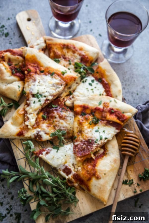 Simple Hot Honey Pepperoni Pizza 8 Pepperoni pizza with hot honey drizzle, garnished with fresh herbs