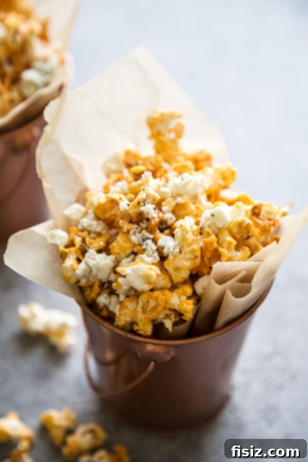 Buffalo Blaze Popcorn 3 Close-up of Buffalo Wing Popcorn seasoned with blue cheese and chives