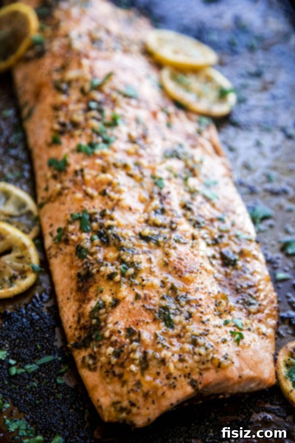 Spicy Cajun Salmon with Rich Garlic Parmesan Sauce 6 Baked Cajun Parmesan Salmon on a sheet pan.