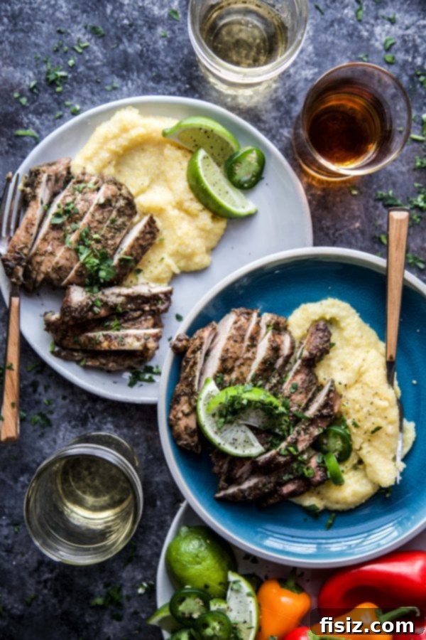 January's Creative Kickoff: My Must-Make List 5 A plate of savory Jerk Chicken Thighs with creamy Jalapeno Polenta, garnished with fresh herbs