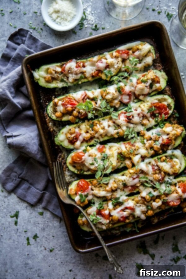January's Creative Kickoff: My Must-Make List 6 Delicious Tuscan Chickpea Stuffed Zucchini Boats, baked to perfection and garnished with fresh herbs