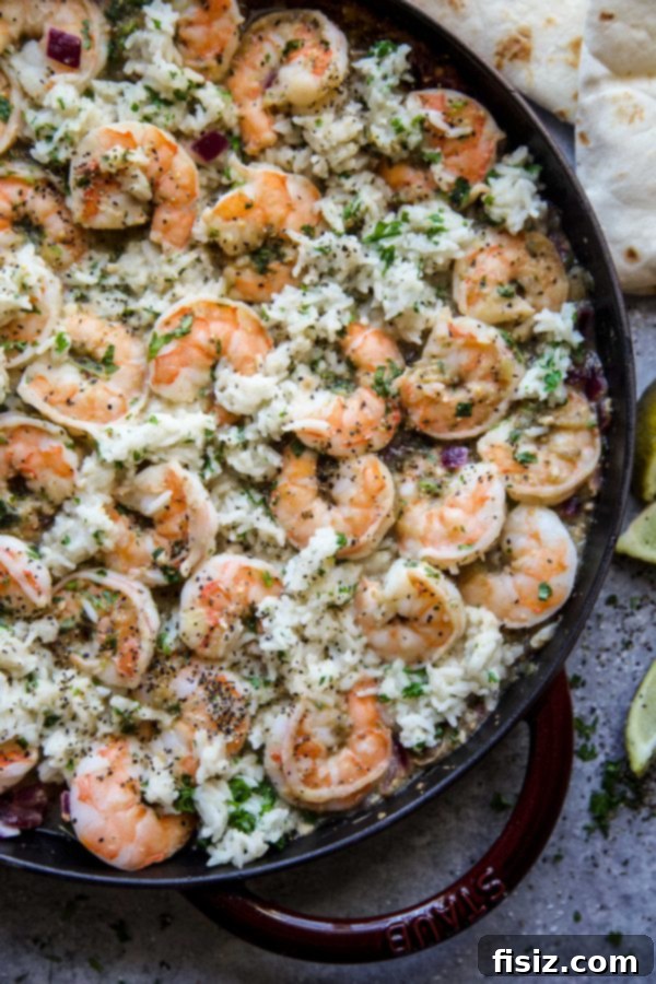 Zesty Salsa Verde Shrimp and Cilantro Rice Skillet 3 Close-up shot of the Salsa Verde Shrimp and Cilantro Rice Skillet with a fork, showing textures