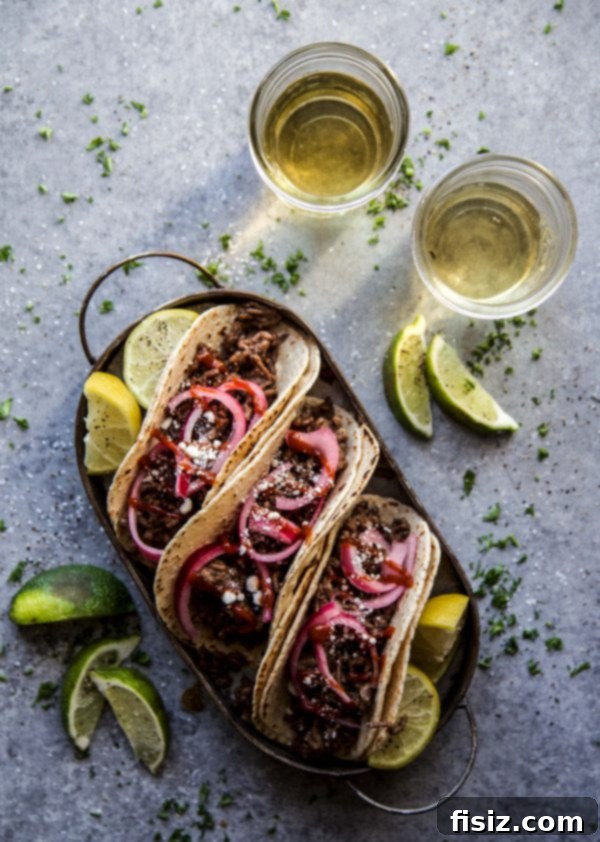 Sesame Beef Tacos with Tangy Pickled Onions 7 Sesame Beef Tacos with Quick Pickled Onions on a plate
