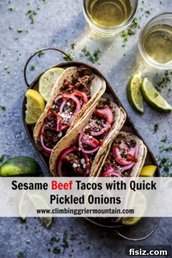Sesame Beef Tacos with Tangy Pickled Onions 9 Sesame Beef Tacos with Quick Pickled Onions on a plate